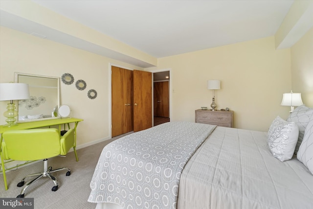 bedroom featuring baseboards and carpet flooring
