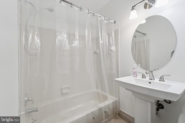 bathroom with shower / bathtub combination with curtain