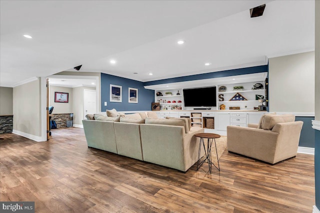 living area with crown molding, recessed lighting, baseboards, and wood finished floors
