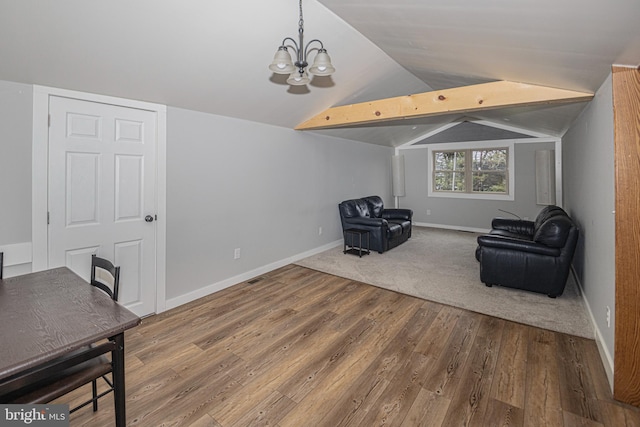 116 N 8th St Unit 2, Oakland, MD 21550 - sitting room with wood finished floors, a notable chandelier, vaulted ceiling, and baseboards