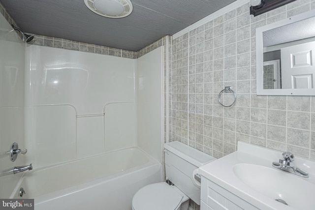 116 N 8th St Unit 2, Oakland, MD 21550 - bathroom featuring toilet, tile walls, shower / bathtub combination, and vanity