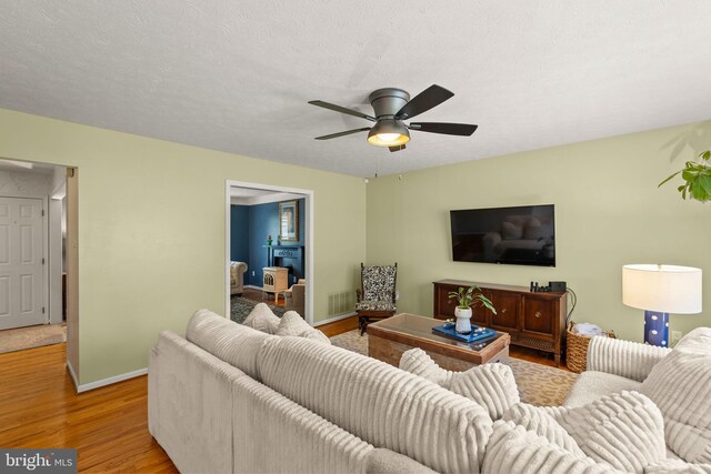 260 High Banks Rd, Stephenson, VA 22656 - living area with ceiling fan, baseboards, wood finished floors, and visible vents