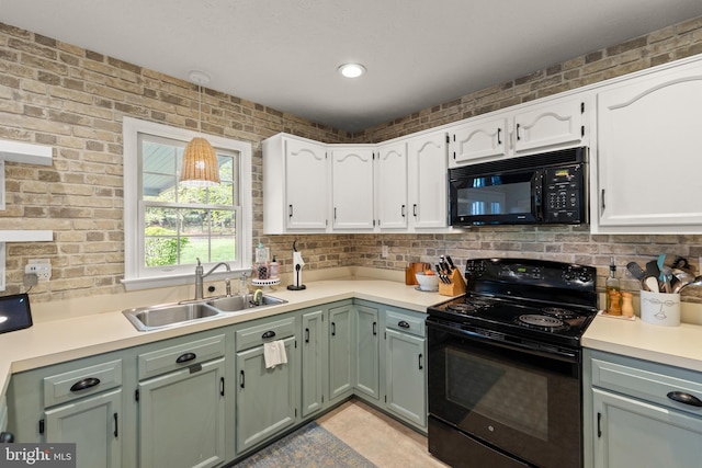 260 High Banks Rd, Stephenson, VA 22656 - kitchen with tasteful backsplash, light countertops, black appliances, a sink, and white cabinetry