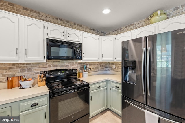 260 High Banks Rd, Stephenson, VA 22656 - kitchen with black appliances, white cabinetry, light countertops, and backsplash