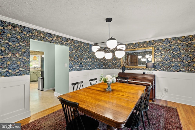 260 High Banks Rd, Stephenson, VA 22656 - dining room with wood finished floors, crown molding, and wallpapered walls