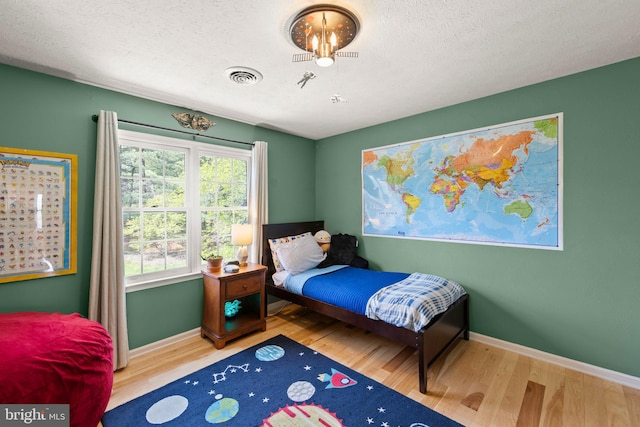 260 High Banks Rd, Stephenson, VA 22656 - bedroom featuring wood finished floors, visible vents, and baseboards