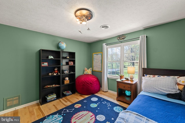 260 High Banks Rd, Stephenson, VA 22656 - bedroom with a textured ceiling, visible vents, wood finished floors, and baseboards