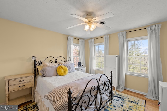 260 High Banks Rd, Stephenson, VA 22656 - bedroom with baseboards, visible vents, ceiling fan, and light wood-style flooring