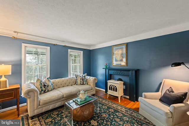 260 High Banks Rd, Stephenson, VA 22656 - living room featuring baseboards, wood finished floors, a textured ceiling, and crown molding