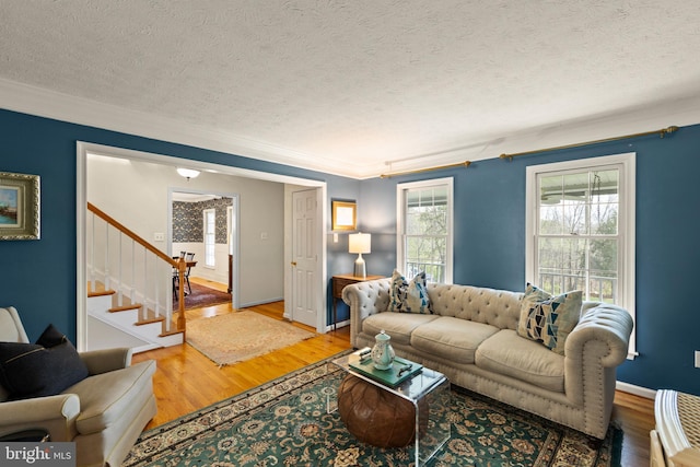 260 High Banks Rd, Stephenson, VA 22656 - living room with ornamental molding, a textured ceiling, light wood-style flooring, and stairway