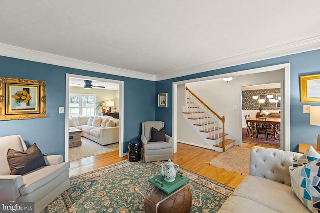 260 High Banks Rd, Stephenson, VA 22656 - living room with stairway, wood finished floors, and ornamental molding