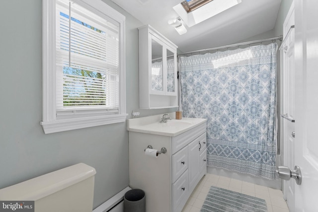 full bath with a baseboard radiator, toilet, tile patterned floors, vanity, and a skylight