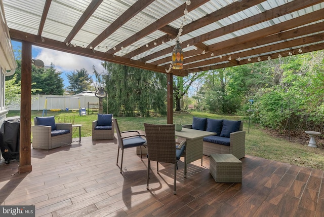 view of patio / terrace featuring an outdoor living space and fence