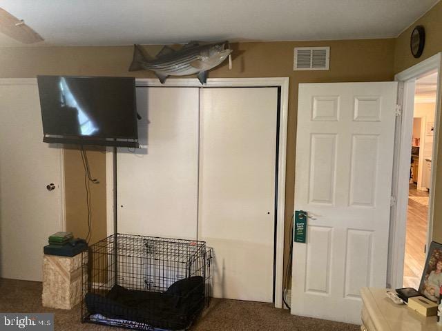 interior space with a closet and visible vents
