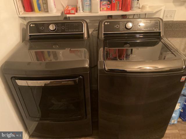 laundry area featuring laundry area and washer and dryer