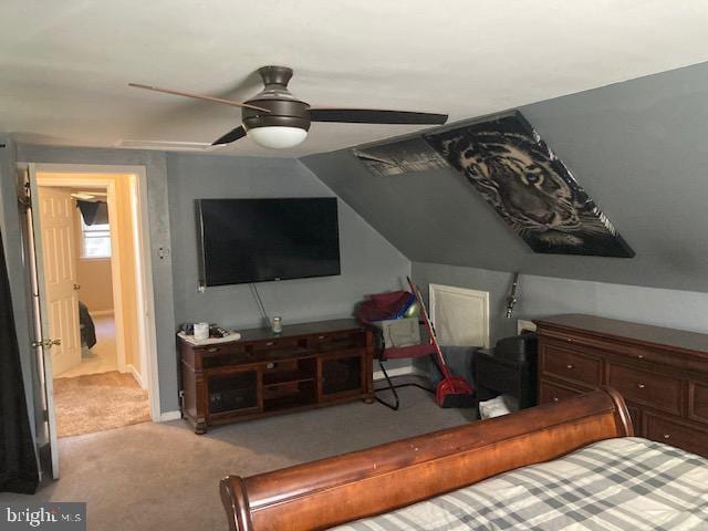 carpeted bedroom with baseboards and a ceiling fan