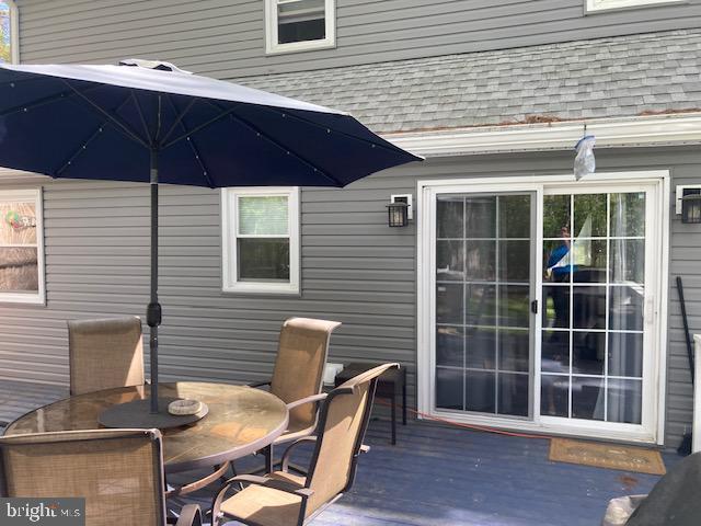 wooden deck with outdoor dining area