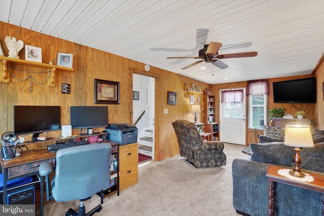 carpeted office space with wood walls, ceiling fan, and wooden ceiling