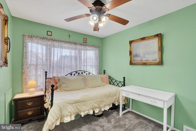 bedroom featuring carpet floors, ceiling fan, visible vents, and baseboards