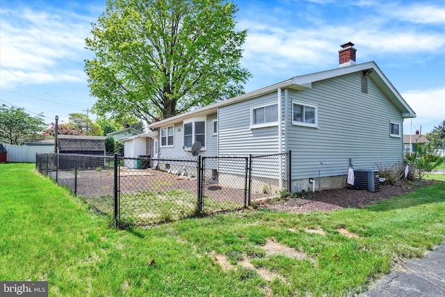 view of property exterior with fence, a yard, a chimney, and cooling unit