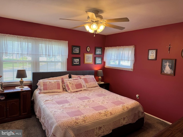 bedroom with multiple windows, carpet, and ceiling fan