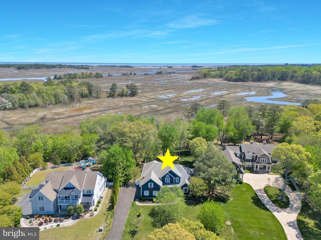 drone / aerial view featuring a water view and a residential view