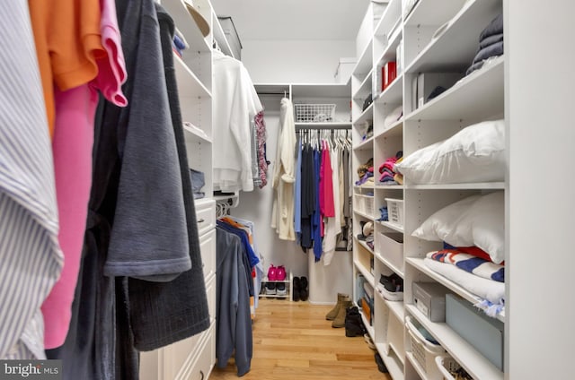 spacious closet with wood finished floors