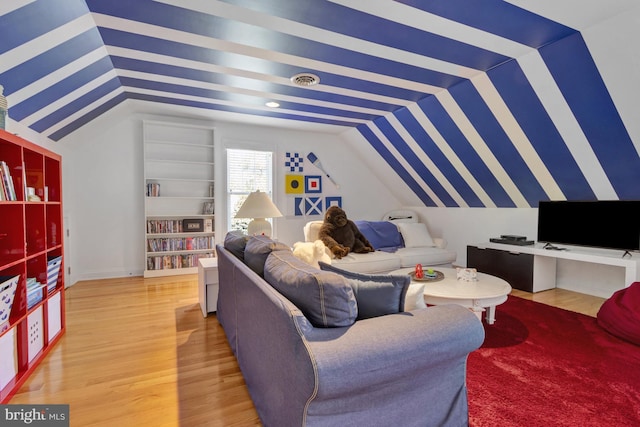 living room featuring light wood-style flooring and lofted ceiling