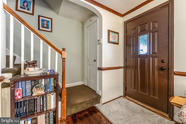 235 Medwick Garth E, Baltimore, MD 21228 - entrance foyer with marble finish floor, ornamental molding, stairway, arched walkways, and baseboards