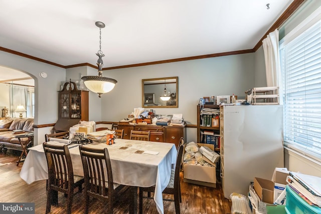 235 Medwick Garth E, Baltimore, MD 21228 - dining space featuring arched walkways, ornamental molding, and dark wood finished floors