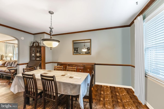 235 Medwick Garth E, Baltimore, MD 21228 - dining room featuring crown molding, arched walkways, dark wood-style floors, and baseboards
