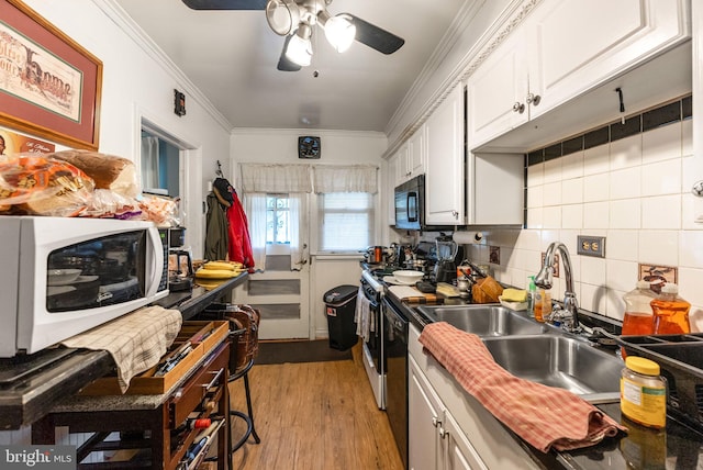 235 Medwick Garth E, Baltimore, MD 21228 - kitchen featuring a sink, white cabinets, ceiling fan, white microwave, and ornamental molding