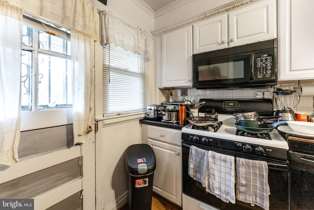 235 Medwick Garth E, Baltimore, MD 21228 - kitchen with gas range oven, a healthy amount of sunlight, black microwave, crown molding, and white cabinets