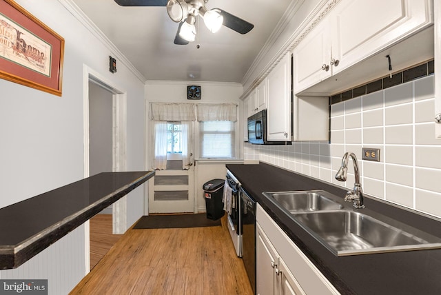 235 Medwick Garth E, Baltimore, MD 21228 - kitchen featuring dark countertops, light wood-style floors, white cabinetry, and a sink