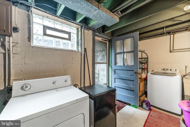 235 Medwick Garth E, Baltimore, MD 21228 - clothes washing area featuring light floors, laundry area, and washer and clothes dryer