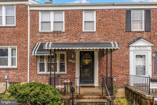 235 Medwick Garth E, Baltimore, MD 21228 - view of front facade featuring brick siding