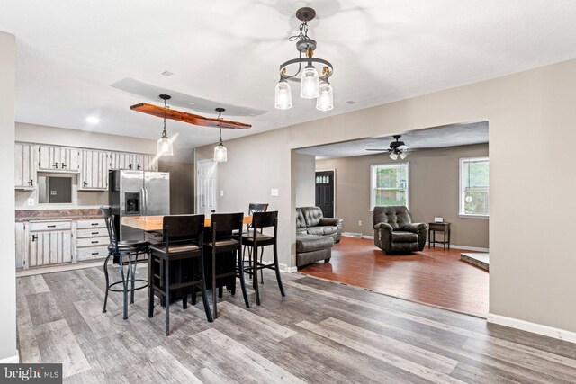 1604 Kathryn St, New Cumberland, PA 17070 - dining room featuring light wood-type flooring, baseboards, and a ceiling fan