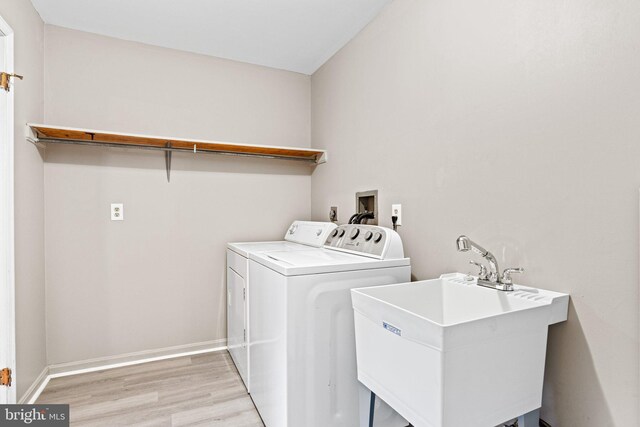 1604 Kathryn St, New Cumberland, PA 17070 - laundry room featuring washing machine and clothes dryer, light wood-style flooring, and baseboards