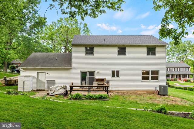1604 Kathryn St, New Cumberland, PA 17070 - back of house featuring a lawn, central AC unit, and a shingled roof