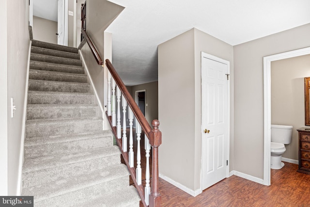 1604 Kathryn St, New Cumberland, PA 17070 - stairway featuring wood finished floors and baseboards