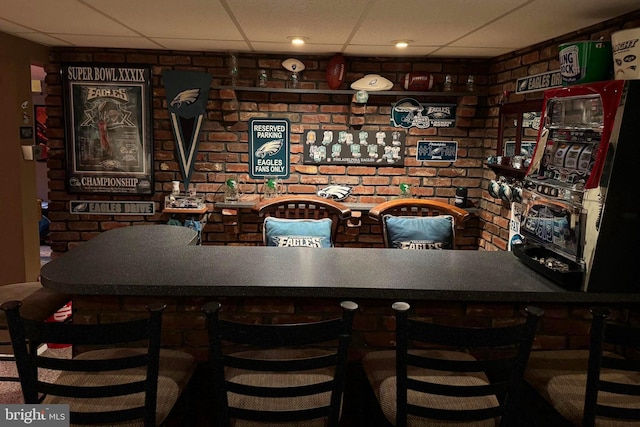 bar featuring a paneled ceiling