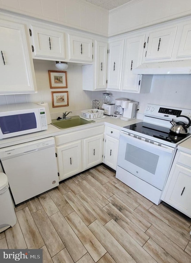 11 91st St Unit 102, Ocean City, MD 21842 - kitchen featuring a sink, light wood-style flooring, white appliances, and white cabinetry