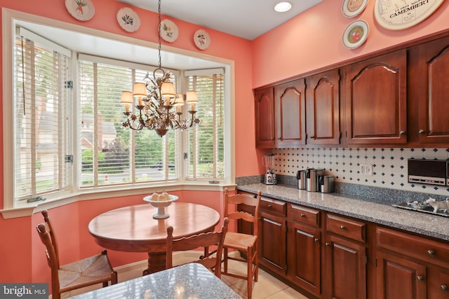 10204 Aspen Willow Dr, Fairfax, VA 22032 - kitchen with healthy amount of natural light, pendant lighting, and tasteful backsplash