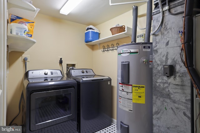 10204 Aspen Willow Dr, Fairfax, VA 22032 - laundry room with electric water heater and washing machine and clothes dryer