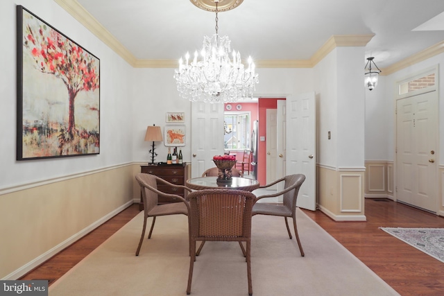 10204 Aspen Willow Dr, Fairfax, VA 22032 - dining area with ornamental molding, wood finished floors, a wainscoted wall, and a chandelier