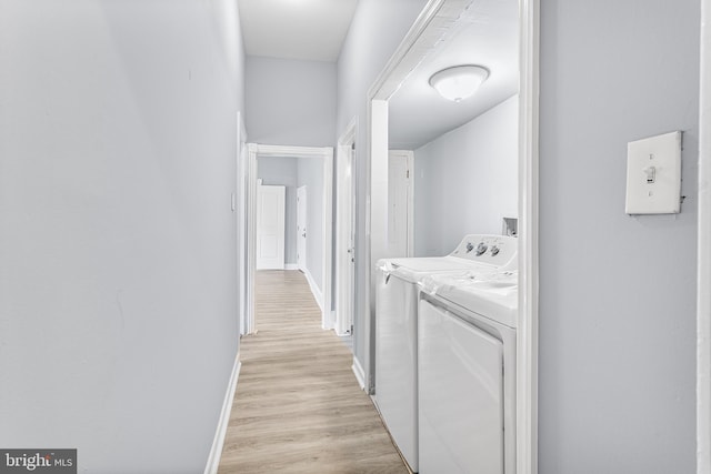 840 Cumberland St, Gloucester City, NJ 08030 - washroom with washer and clothes dryer, baseboards, and light wood-type flooring