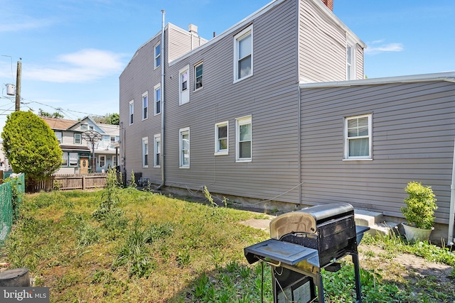 840 Cumberland St, Gloucester City, NJ 08030 - view of home's exterior with fence and a chimney