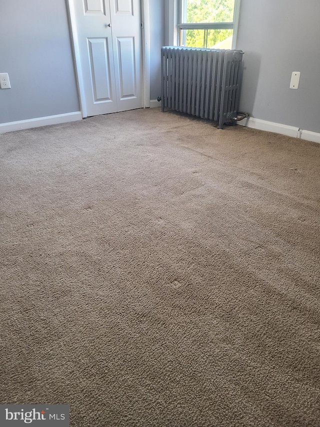 840 Cumberland St, Gloucester City, NJ 08030 - unfurnished room with radiator heating unit, carpet flooring, and baseboards