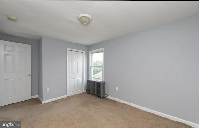 840 Cumberland St, Gloucester City, NJ 08030 - unfurnished bedroom with radiator heating unit, baseboards, a closet, and light colored carpet