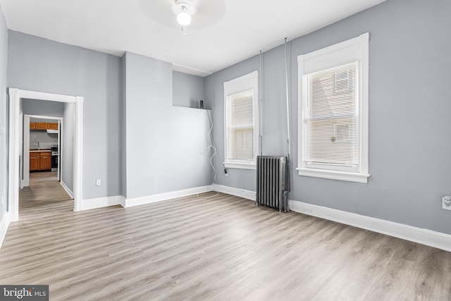 840 Cumberland St, Gloucester City, NJ 08030 - spare room featuring radiator, wood finished floors, ceiling fan, and baseboards